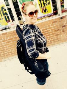 Imaginary Rockstar Carrying a REAL travel guitar. (Not my own.) 